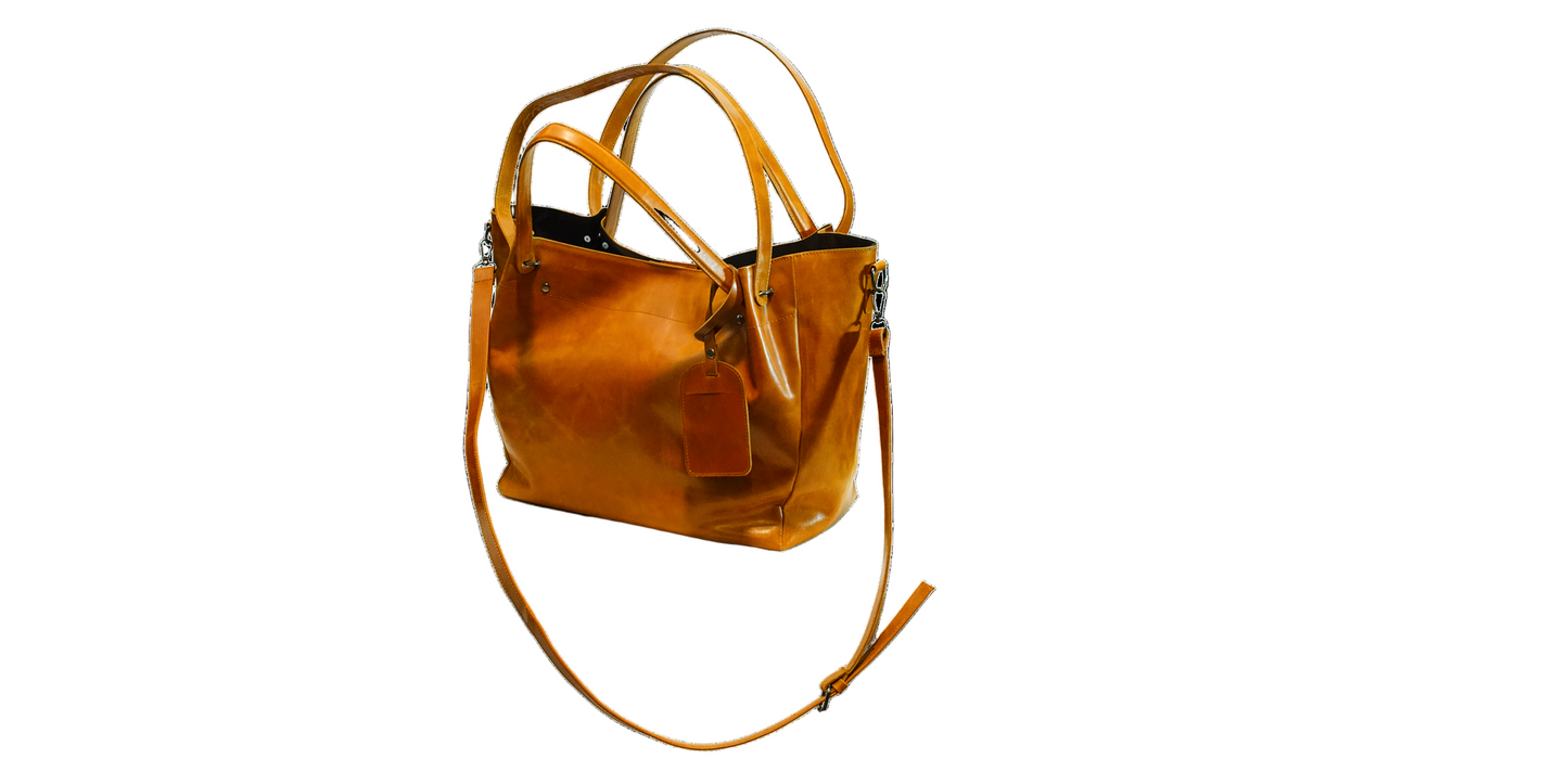 Brown leather handbag on a white background